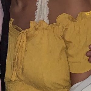 mustard yellow blouse she in